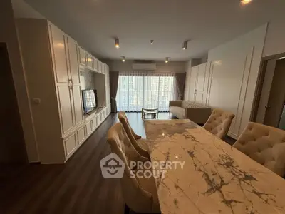 Luxurious living room with elegant marble dining table and spacious seating area