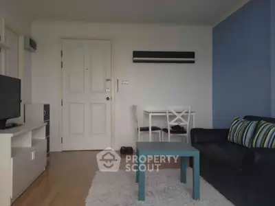 Cozy living room with modern furniture and blue accent wall
