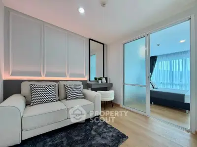 Modern living room with stylish decor and cozy seating in a contemporary apartment.