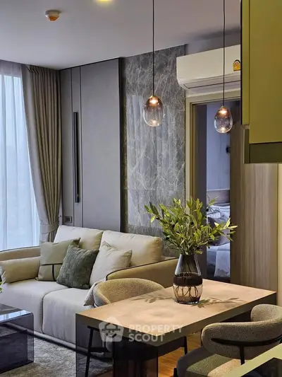 Modern living room with stylish decor and cozy seating area in a contemporary apartment.
