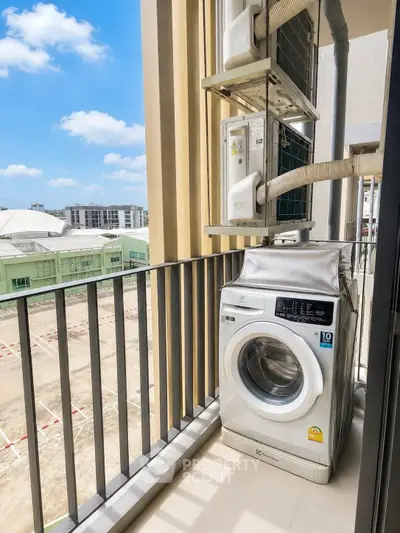 Modern balcony with washing machine and city view, perfect for urban living convenience.