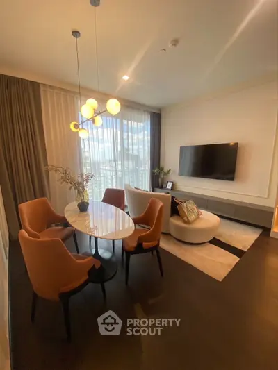 Elegant living room with modern furniture and large window offering city views