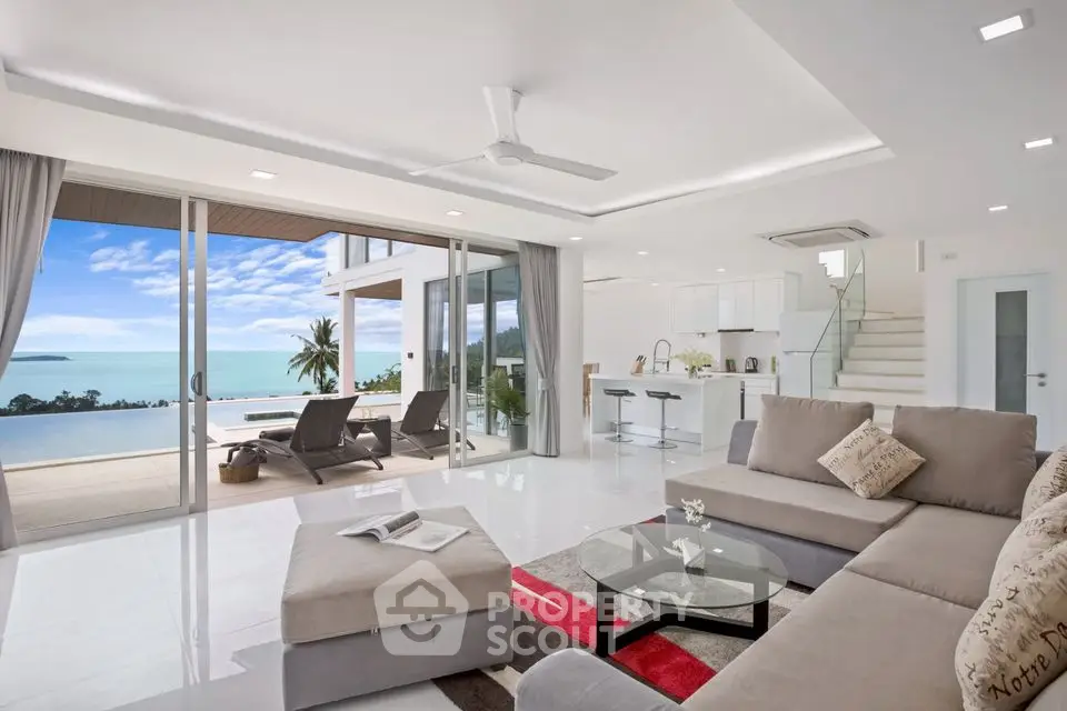 Luxurious open-plan living room with ocean view and modern decor