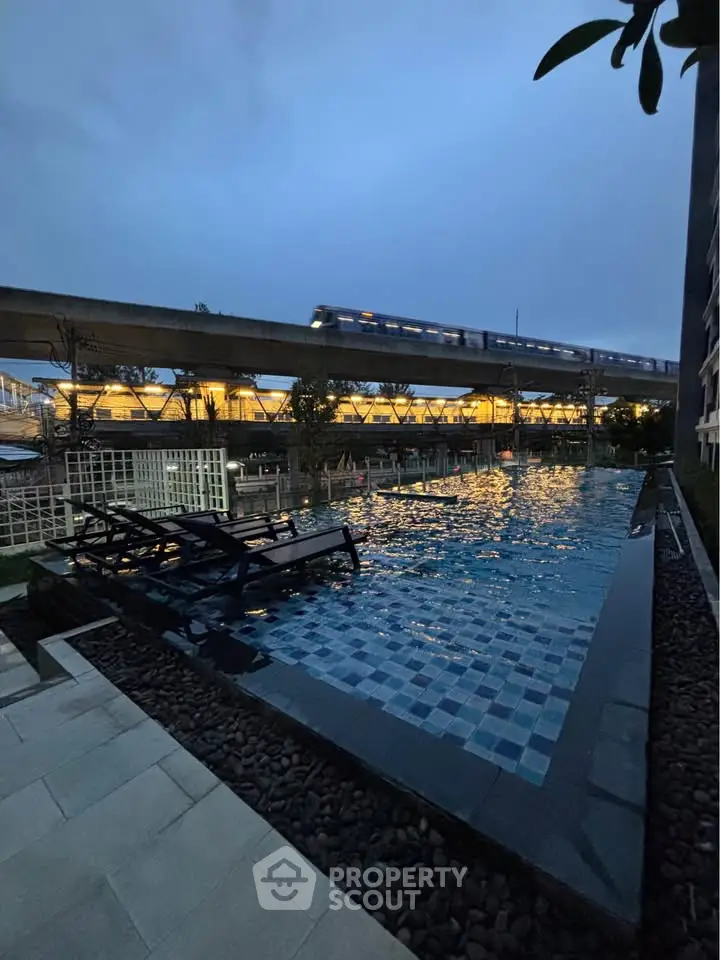 Luxurious rooftop pool with stunning city view and modern design near transit line.