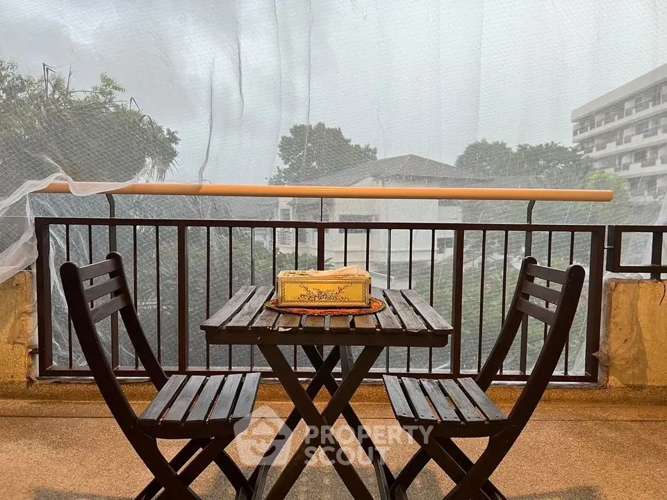 Charming balcony with cozy seating and serene view, perfect for relaxation and enjoying outdoor moments.