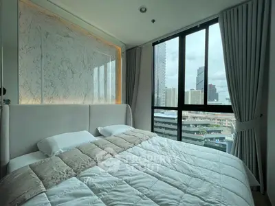 Luxurious bedroom with stunning city view and elegant decor