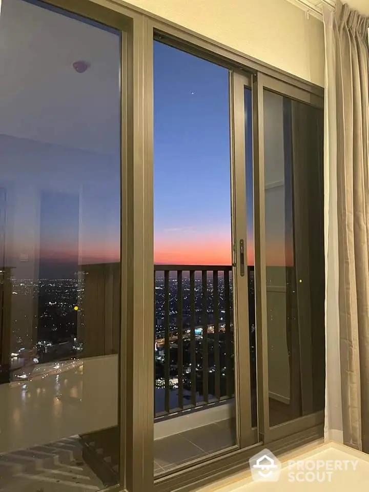 Stunning high-rise balcony view with city skyline at sunset