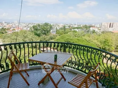 Charming balcony with stunning cityscape view, perfect for relaxation and enjoying the outdoors.