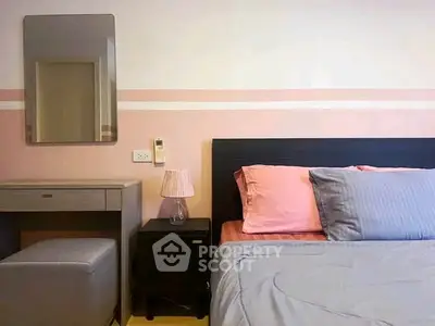 Cozy bedroom with stylish decor and comfortable bedding, perfect for relaxation.