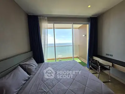 Luxurious bedroom with ocean view and private balcony in modern apartment