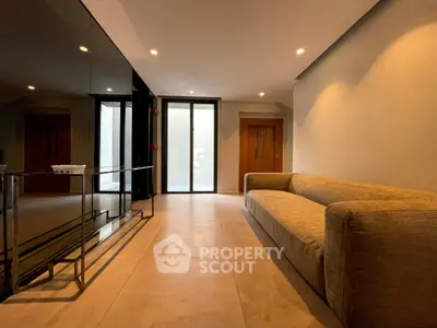 Modern living room with sleek design and comfortable sofa