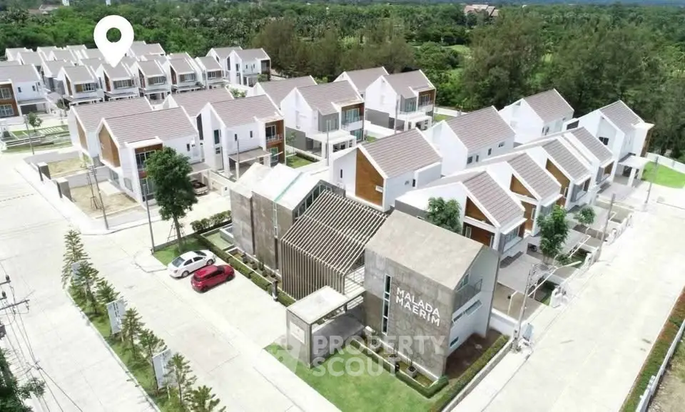 Modern residential complex with stylish townhouses and lush greenery, offering serene suburban living.