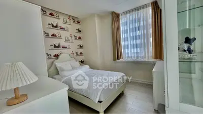 Charming bedroom with cozy decor and large window in modern apartment