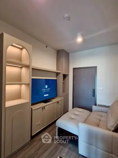 Modern living room with sleek furniture and built-in entertainment center