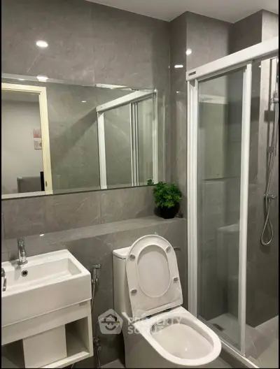 Modern bathroom with sleek design and glass shower enclosure