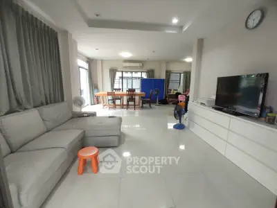 Spacious living room with modern furniture and large windows