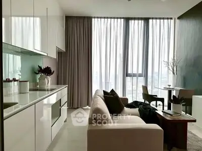 Modern living room with sleek kitchen, large windows, and stylish decor in a high-rise apartment.