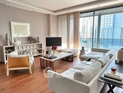 Spacious modern living room with large windows and city view
