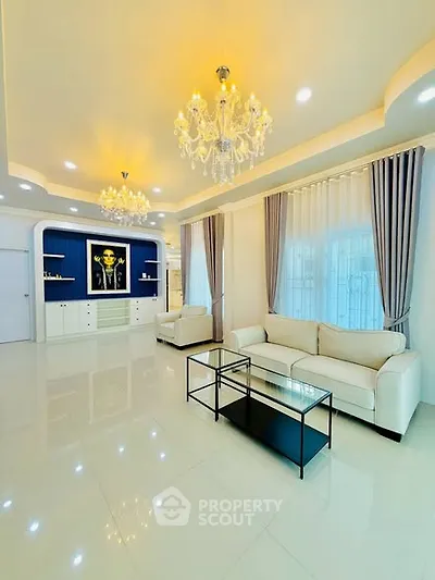 Luxurious living room with elegant chandeliers and modern decor