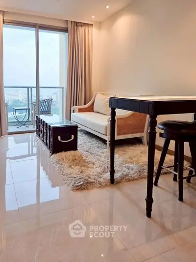 Modern living room with elegant decor and balcony view