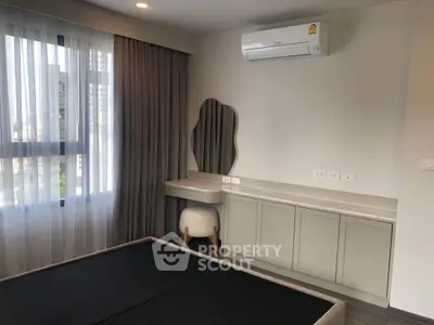 Modern bedroom with air conditioning and stylish vanity desk