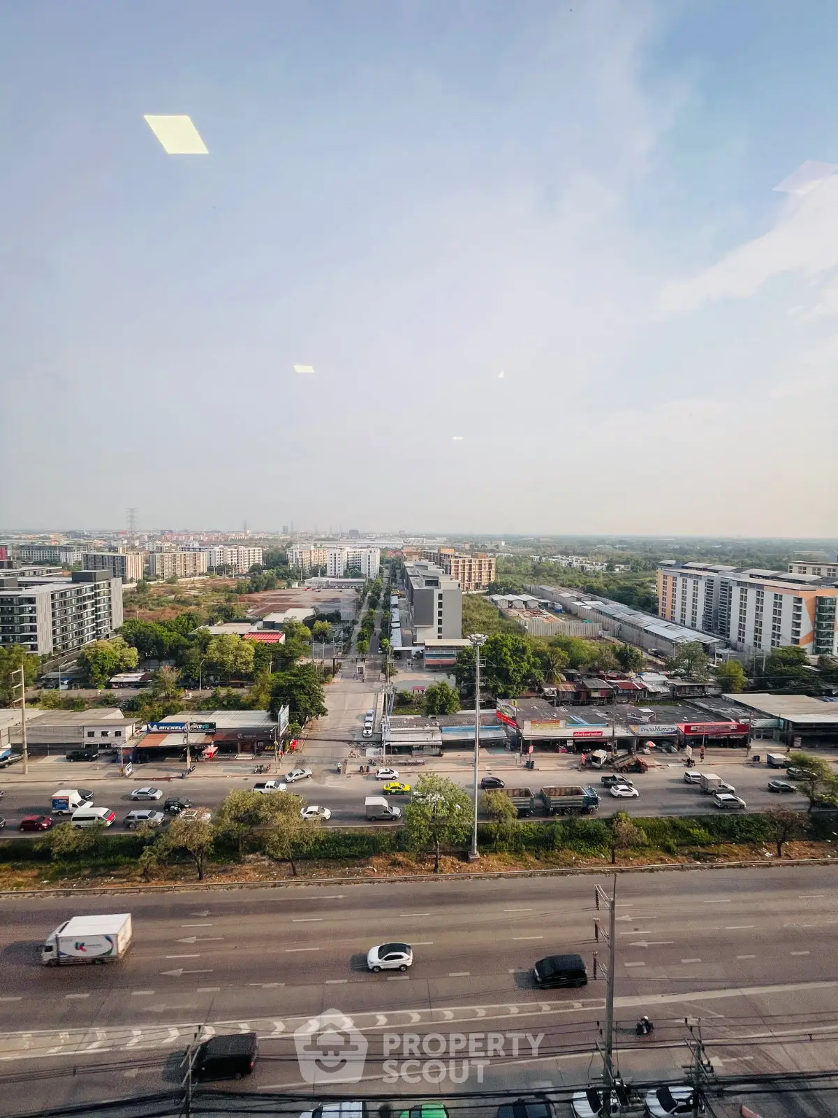 Stunning cityscape view from high-rise building showcasing urban living and connectivity.