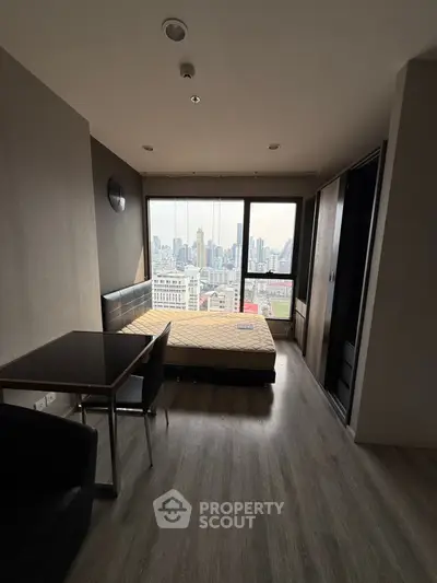 Modern bedroom with stunning city view and sleek furnishings