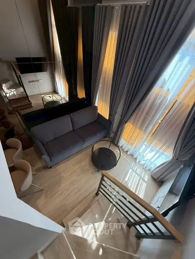 Modern duplex living room with high ceilings and elegant decor