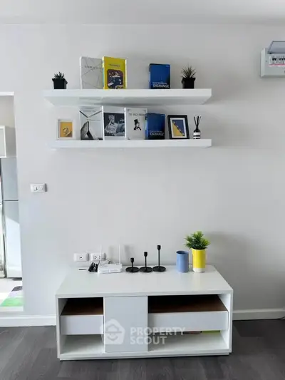 Modern living room with stylish shelves and decor accents