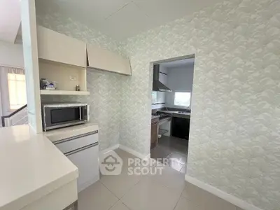 Modern kitchen with open layout and sleek appliances in a stylish home
