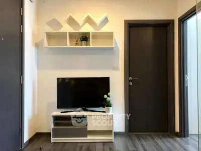 Modern living room with sleek TV unit and stylish wall shelves