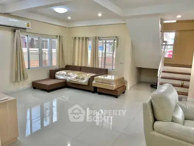 Spacious modern living room with elegant furniture and natural light