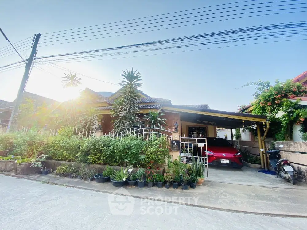 Charming suburban house with lush garden and carport in a serene neighborhood.