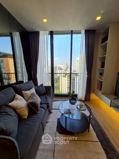 Modern living room with city view, cozy sofa, and stylish decor