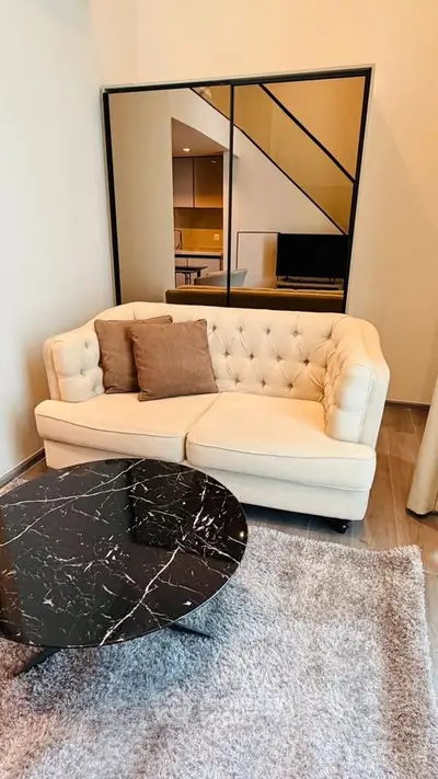 Stylish modern living room with elegant sofa and marble coffee table