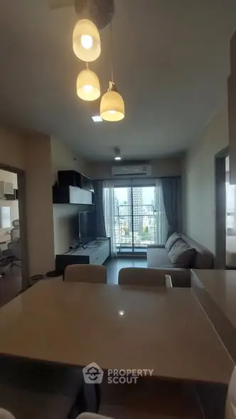 Modern living room with stylish lighting and balcony view