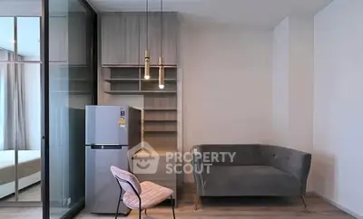 Modern interior with sleek furniture and stylish lighting in a compact living space.