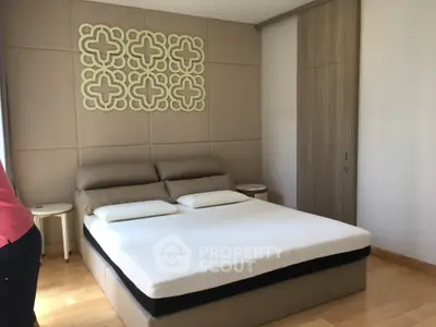 Modern bedroom with stylish decor and comfortable bed in a contemporary home.