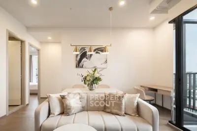 Luxurious modern living room with elegant decor and balcony view