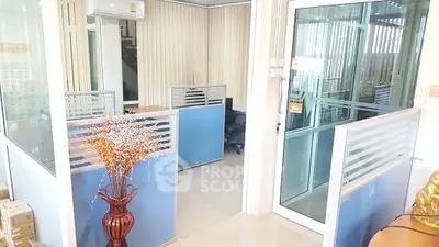 Modern office space with glass partitions and stylish decor