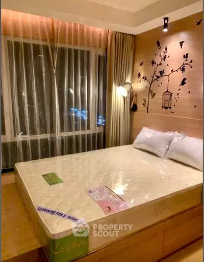 Cozy bedroom with elegant wall art and ambient lighting