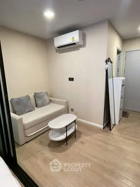 Cozy living room with modern air conditioning and stylish furniture