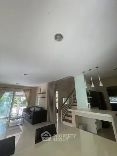 Spacious modern living room with open layout and stylish furniture