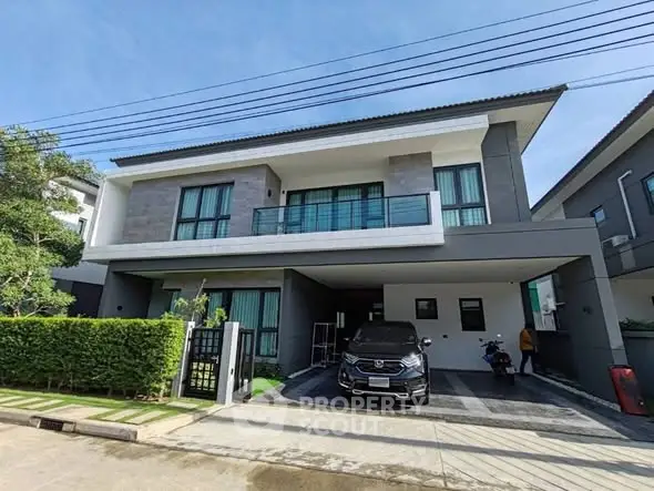 Modern two-story house with sleek design and spacious driveway