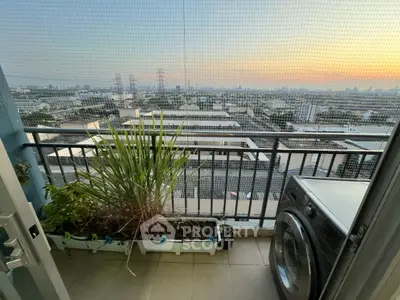Stunning balcony view with cityscape and washing machine, perfect for urban living.