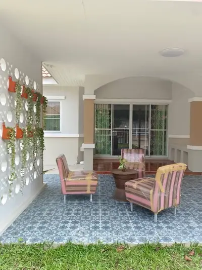 Charming outdoor patio with stylish seating and decorative wall planters.