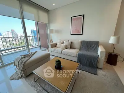 Modern living room with city view, featuring cozy sofa and stylish decor.
