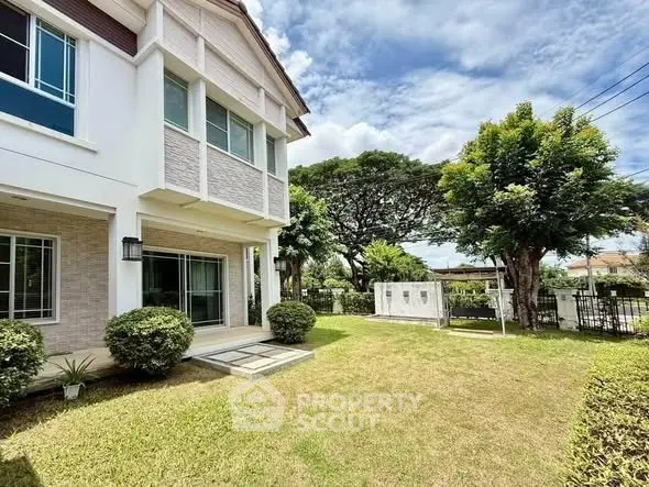 Charming suburban home with lush garden and spacious lawn, perfect for family living.