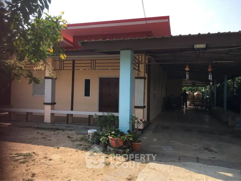 Charming single-story home with spacious outdoor area and covered patio, perfect for relaxation and gatherings.