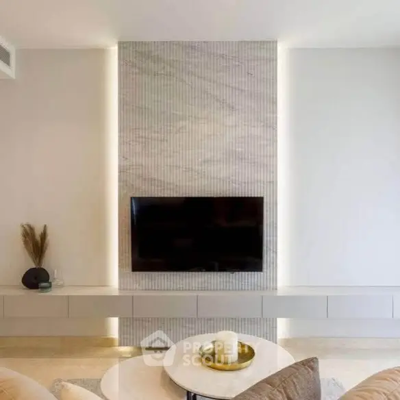 Modern living room with sleek TV wall and elegant decor